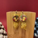 Orecchini siciliani artigianali con limoni su mattonelle caltagirone